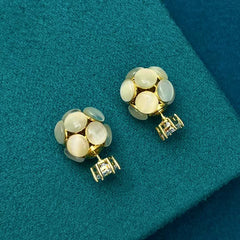 Close-up detail of the sparkling zircons and plating on the Cat's Eye Jacket Earrings