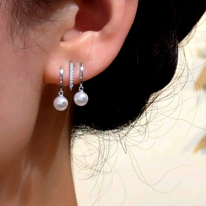 Close-up detail of the sparkling zircons and plating on the Multi-Layer Pearl Earrings