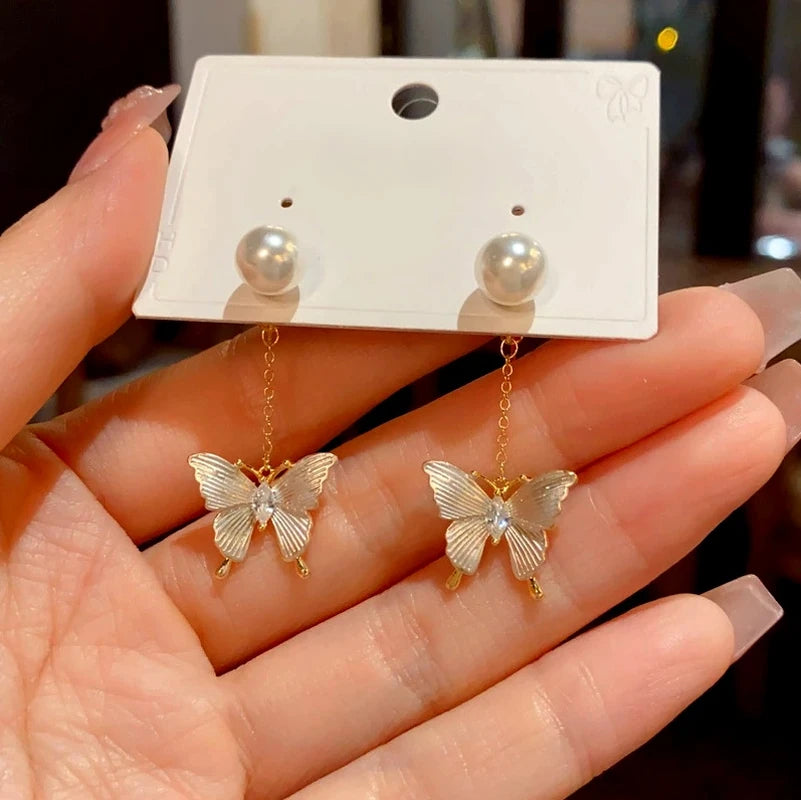 Close-up detail of the sparkling zircons and plating on the Butterfly Pearl Tassel Earrings