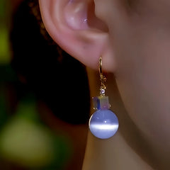 Close-up detail of the sparkling zircons and plating on the Square Bead Earrings