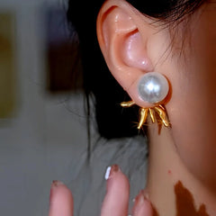 Close-up detail of the sparkling zircons and plating on the Flower Pearl Earrings