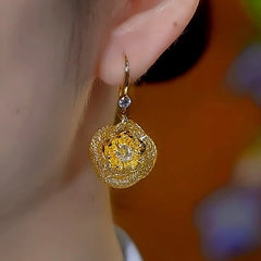 Close-up detail of the sparkling zircons and plating on the Rose Ear Hook