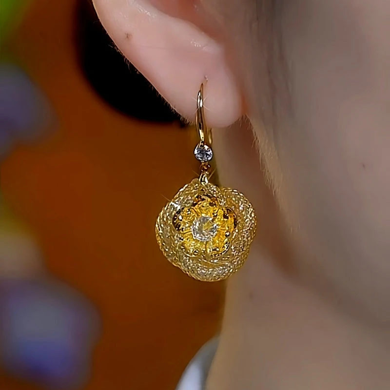 Model showcasing the dangle and style of the 14K Gold-Plated Luxury Diamond Mesh Rose Ear Hook Earrings