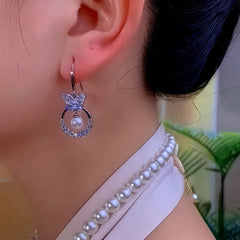 Close-up detail of the sparkling zircons and plating on the Pearl Ear Hooks