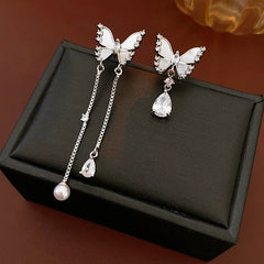 Angled view of the 14K Gold-Plated Zircon Butterfly Tassel Earrings