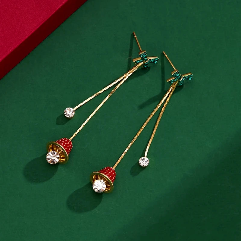 Model showcasing the dangle and style of the 14K Gold-Plated Christmas Zircon Bell Bow Tassel Earrings