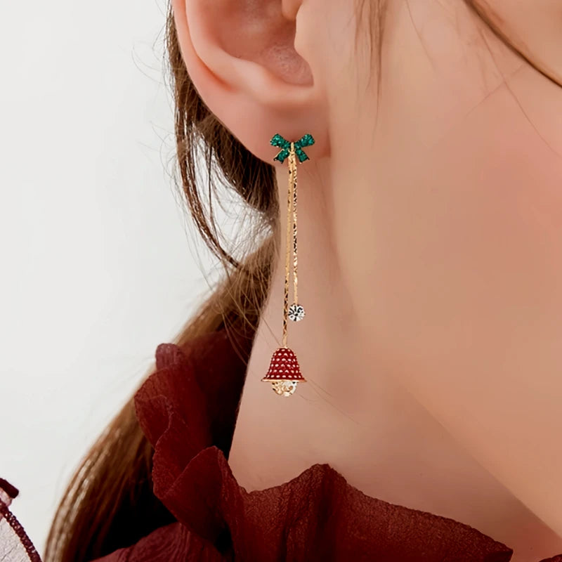 Angled view of the 14K Gold-Plated Christmas Zircon Bell Bow Tassel Earrings