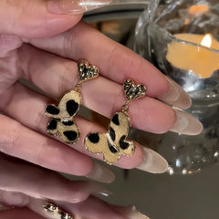 Close-up detail of the sparkling zircons and plating on the leopard print earrings