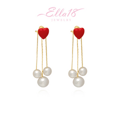 Angled view of the 14K Gold-Pated Red Heart Bead Tassel Earrings