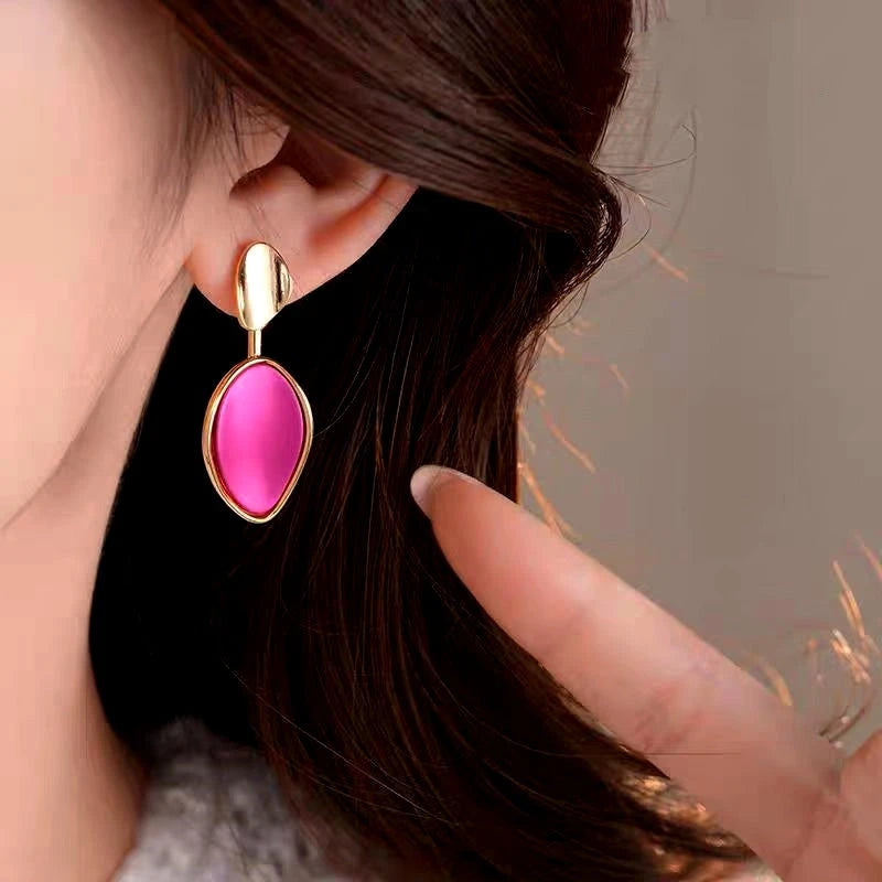 Model showcasing the dangle and style of the 14K Gold-Plated 2025 Elegant Asymmetrical Contrast Color Earrings