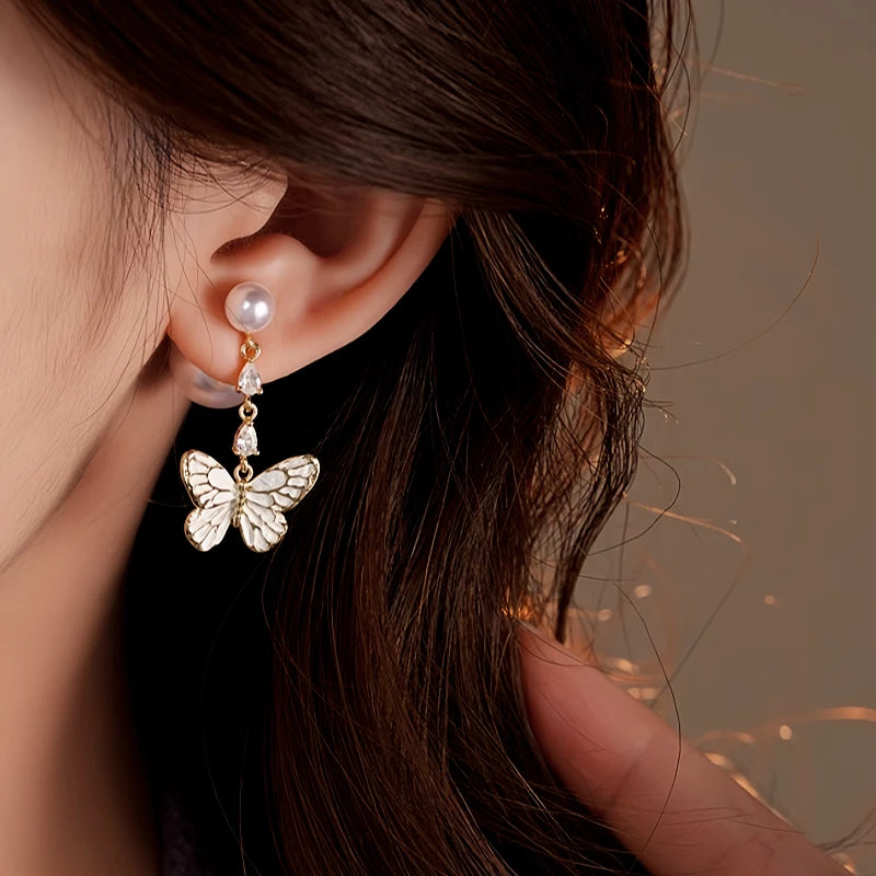 Angled view of the 14K Gold-Plated 2025 Elegant Butterfly Pearl Earrings