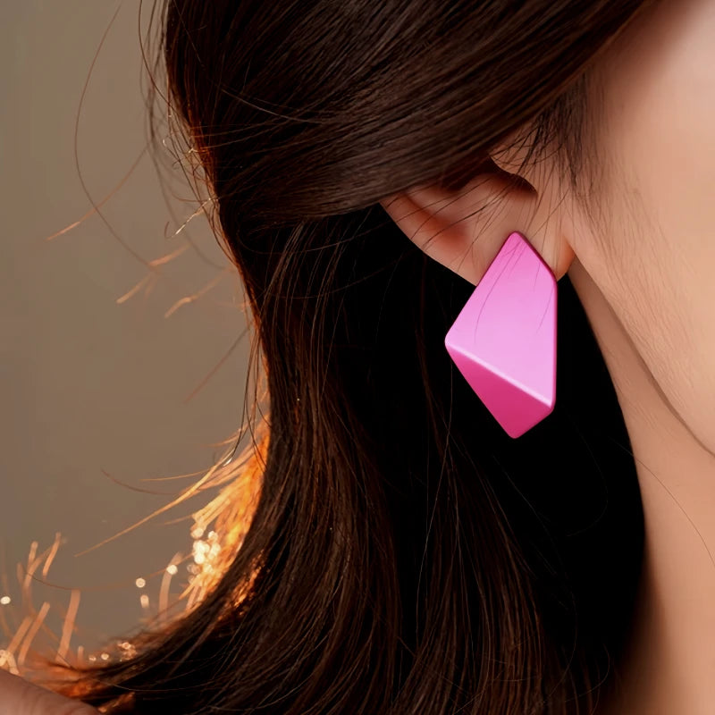 Model showcasing the dangle and style of the 14K Gold-Plated 2025 Elegant Contrasting Geometric Earrings