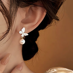 Angled view of the 14K Gold-Plated 2025 Elegant White Butterfly Pearl Earrings