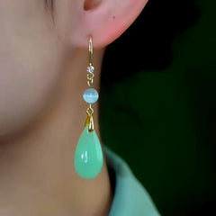 Model showcasing the dangle and style of the 14K Gold-Plated 2025 Elegant Zircon Crystal Ear Hook Earrings