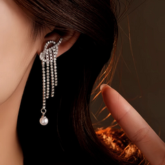 Close-up detail of the sparkling zircons and plating on the gold pearl earrings