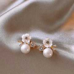 Angled view of the 14K Gold-Plated 2025 Elegant Zircon Flower Pearl Earrings