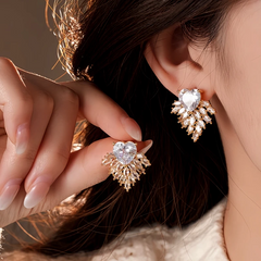 Angled view of the 14K Gold-Plated 2025 Elegant Zircon Heart Firework Earrings