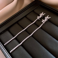 Angled view of the 14K Gold-Plated 2025 Elegant Zircon Letter Tassel Earrings