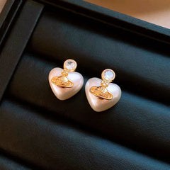 Close-up detail of the sparkling zircons and plating on the saturn earrings