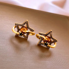 Model showcasing the dangle and style of the 14K Gold-Plated 2025 Elegant Zircon Star Stud Earrings
