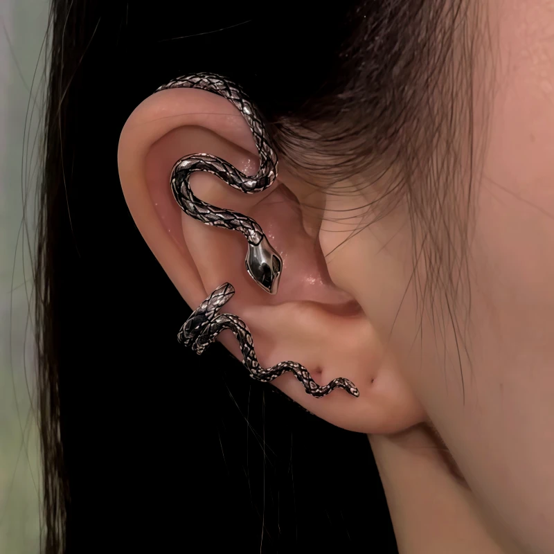 Close-up detail of the sparkling zircons and plating on the silver snake ear cuff