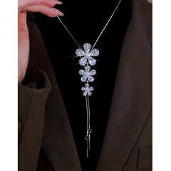 Detailed view of the 14K Gold-Plated Adjustable Flower Sweater Chain Necklace chain and pendant