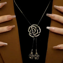 Detailed view of the 14K Gold-Plated Adjustable Rose Sweater Chain Necklace chain and pendant