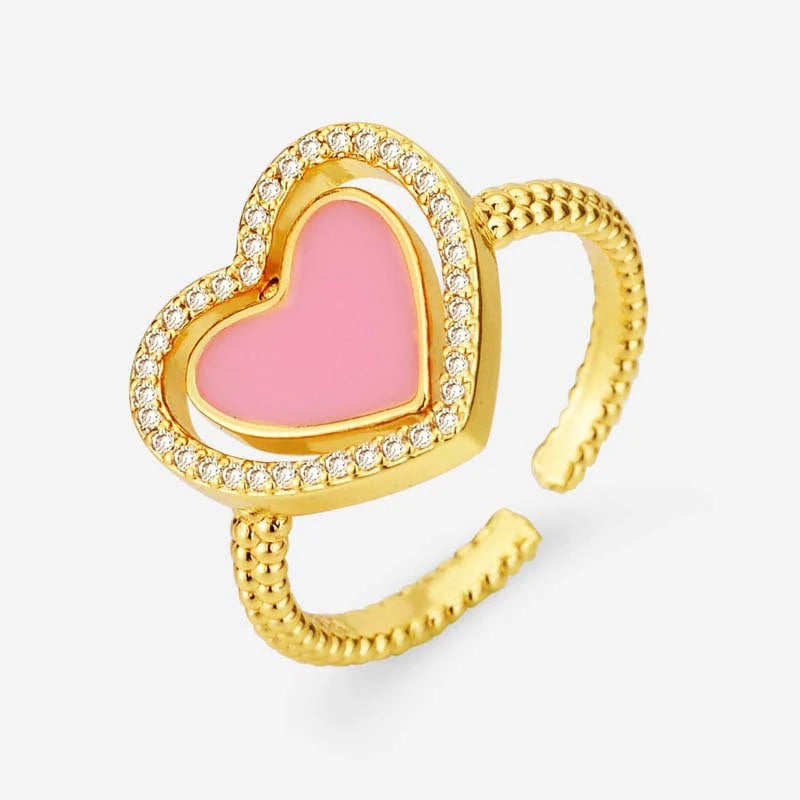 Close-up view of the gemstone and setting of the gold heart ring