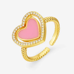 Close-up view of the gemstone and setting of the gold heart ring