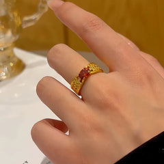 Close-up view of the gemstone and setting of the gold solitaire ring