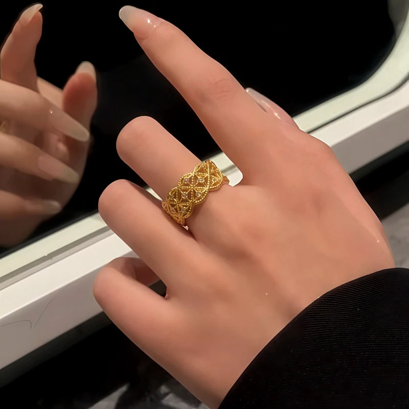 Close-up view of the gemstone and setting of the gold statement ring