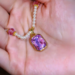 Close-up of the pendant and clasp on the amethyst bead necklace