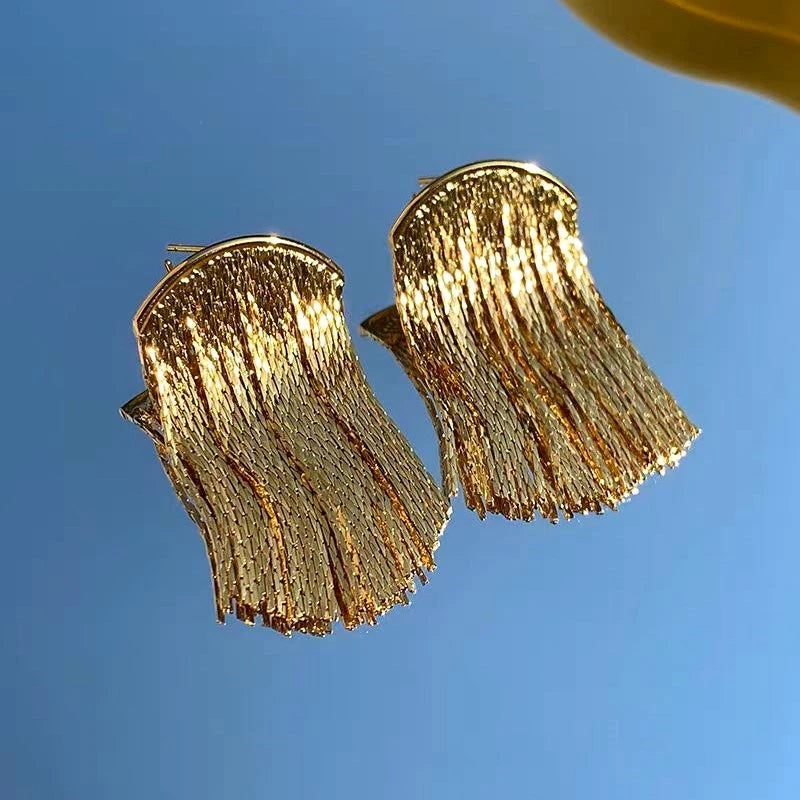 Angled view of the 14K Gold-Plated Arc-Design Waterfall Tassel Earrings