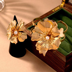 Close-up of the clasp and charm details on the gold flower bracelet