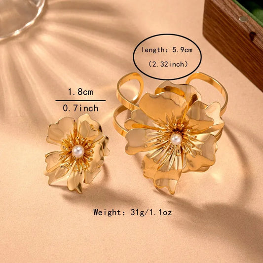 Model wearing the 14K Gold-Plated Artistic Bead Flower Bracelet And Ring Set to highlight its design on the wrist