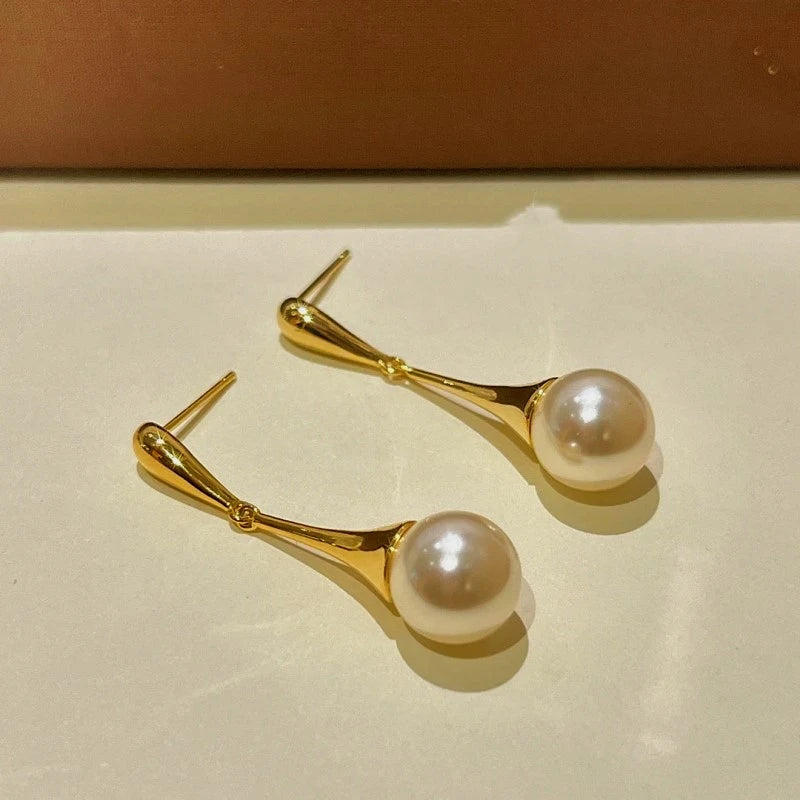 Angled view of the 14K Gold-Plated Bead Tassel Earrings