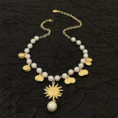 Close-up of the pendant and clasp on the gold sunflower necklace