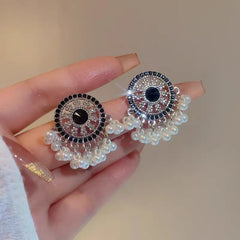 Angled view of the 14K Gold-Plated Beaded Tassel Earrings