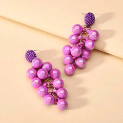 Styling the gold tassel earrings for a chic and modern look