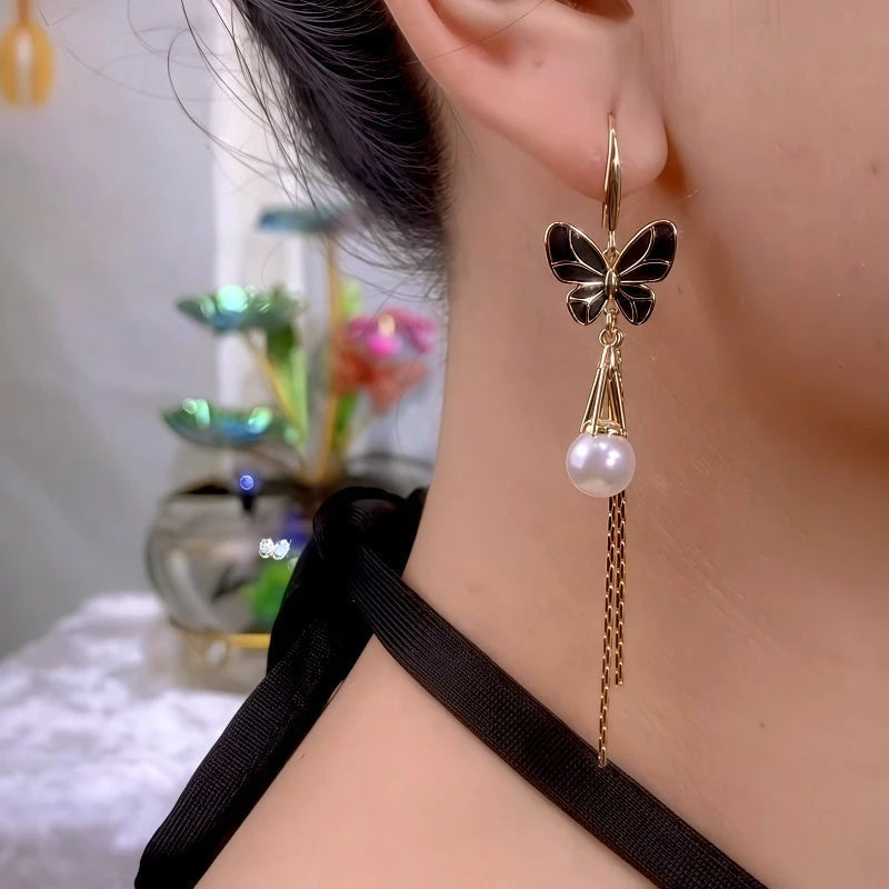 Close-up detail of the sparkling zircons and plating on the gold tassel earrings