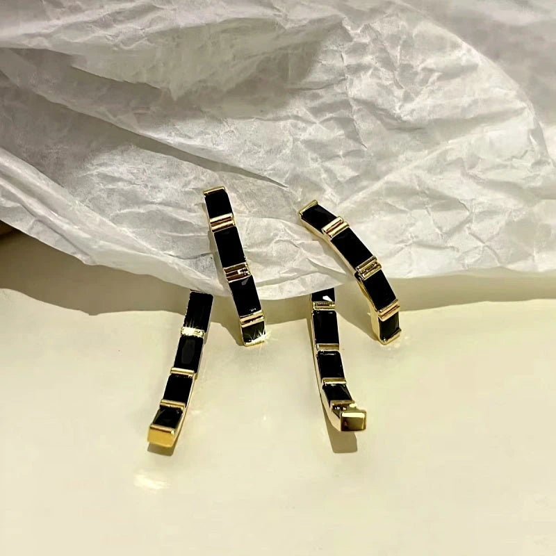 Angled view of the 14K Gold-Plated Black Diamond Earrings