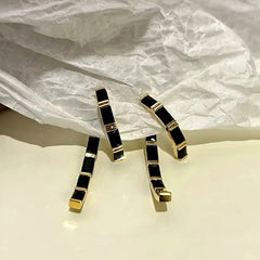 Angled view of the 14K Gold-Plated Black Diamond Earrings