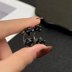 Close-up detail of the sparkling zircons and plating on the Black Zircon Earrings