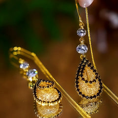 Close-up detail of the sparkling zircons and plating on the Mesh Threader Earrings