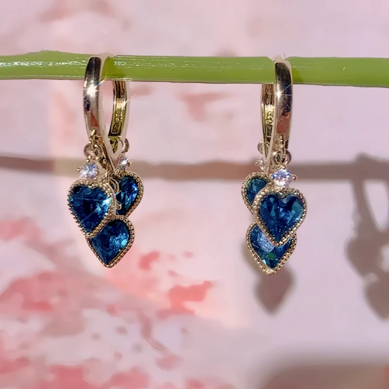 Close-up detail of the sparkling zircons and plating on the Heart Tassel Earrings