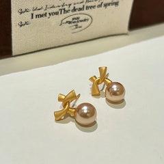 Angled view of the 14K Gold-Plated Bow Bead Earrings