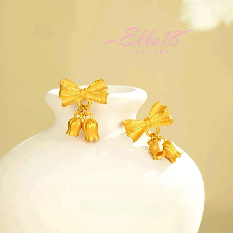 Angled view of the 14K Gold-Plated Bow Orchid Flower Earrings