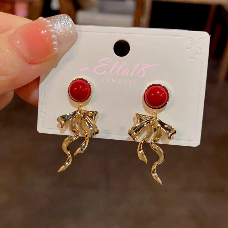 Close-up detail of the sparkling zircons and plating on the Red Tassel Earrings