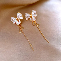 Close-up detail of the sparkling zircons and plating on the White Tassel Earrings