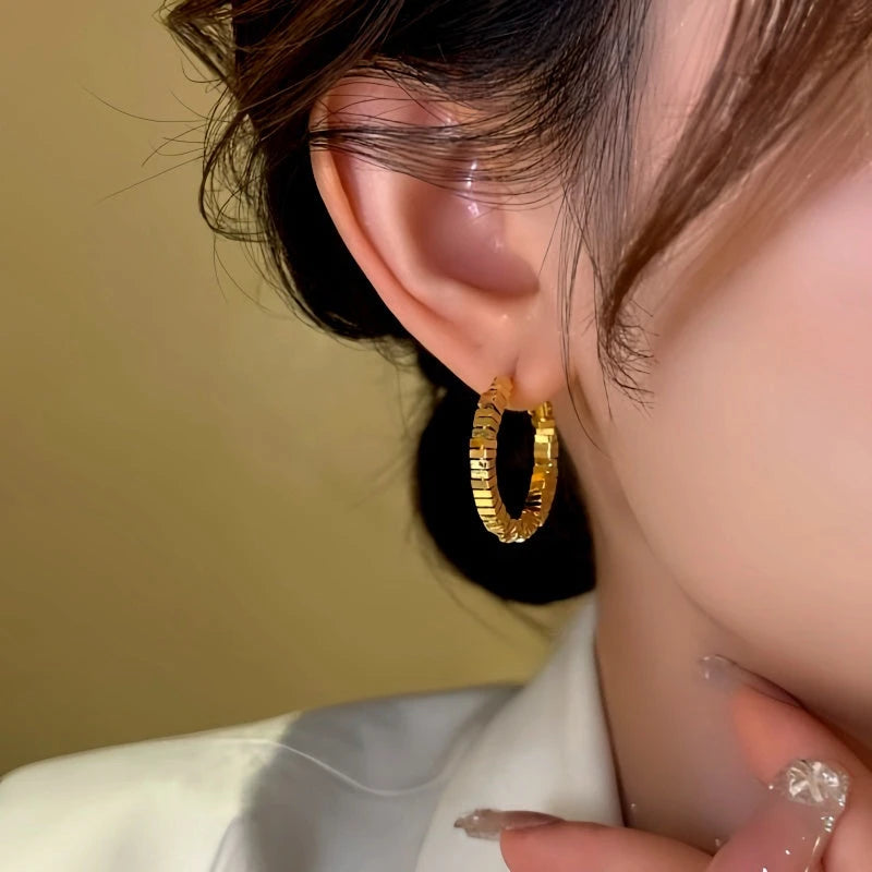 Angled view of the 14K Gold-Plated Broken Diamond Hoop Earrings